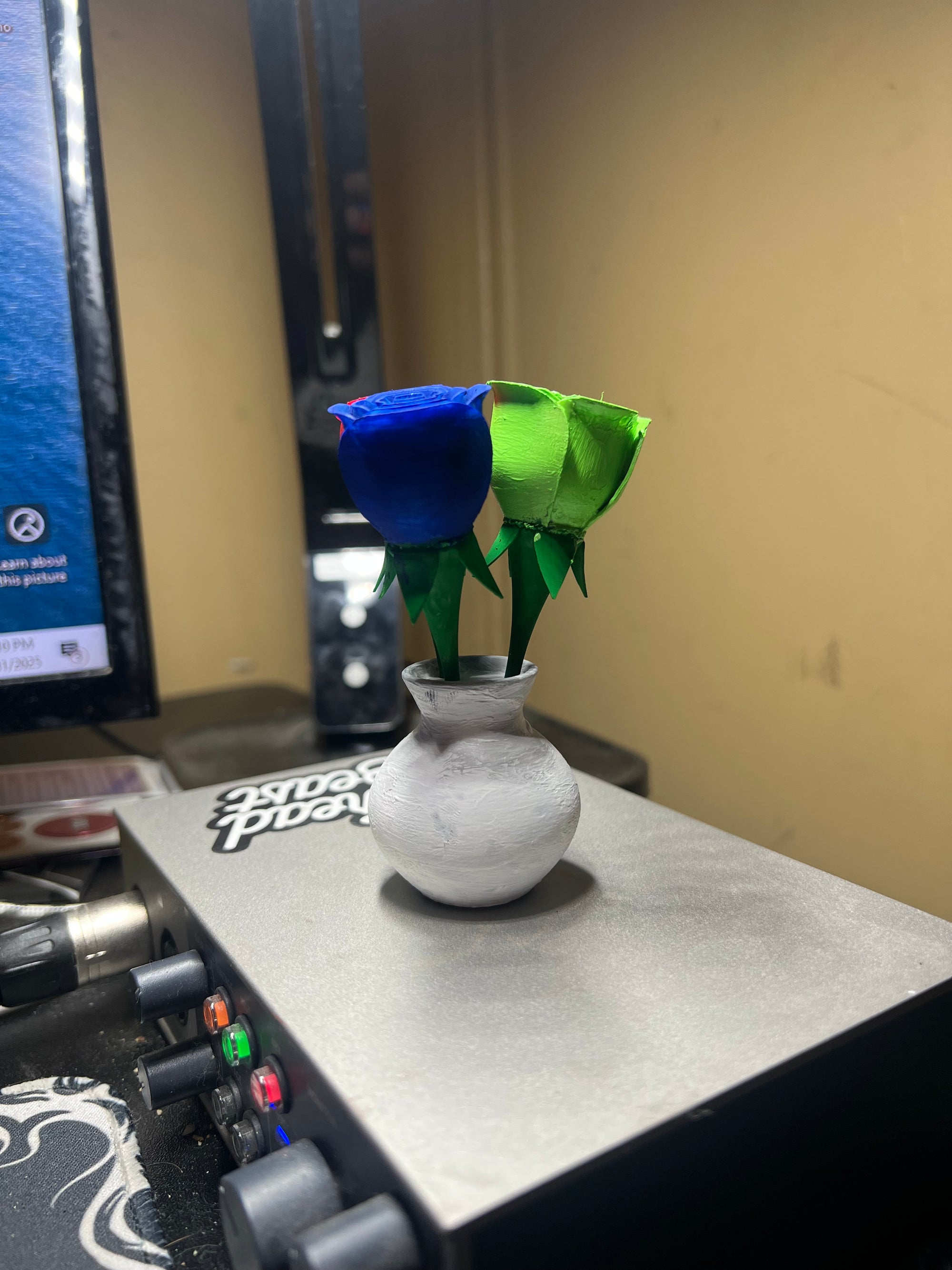 3 painted roses in a vase